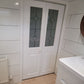 JB Kind Canterbury Glazed White Primed Moulded Bi-fold Door